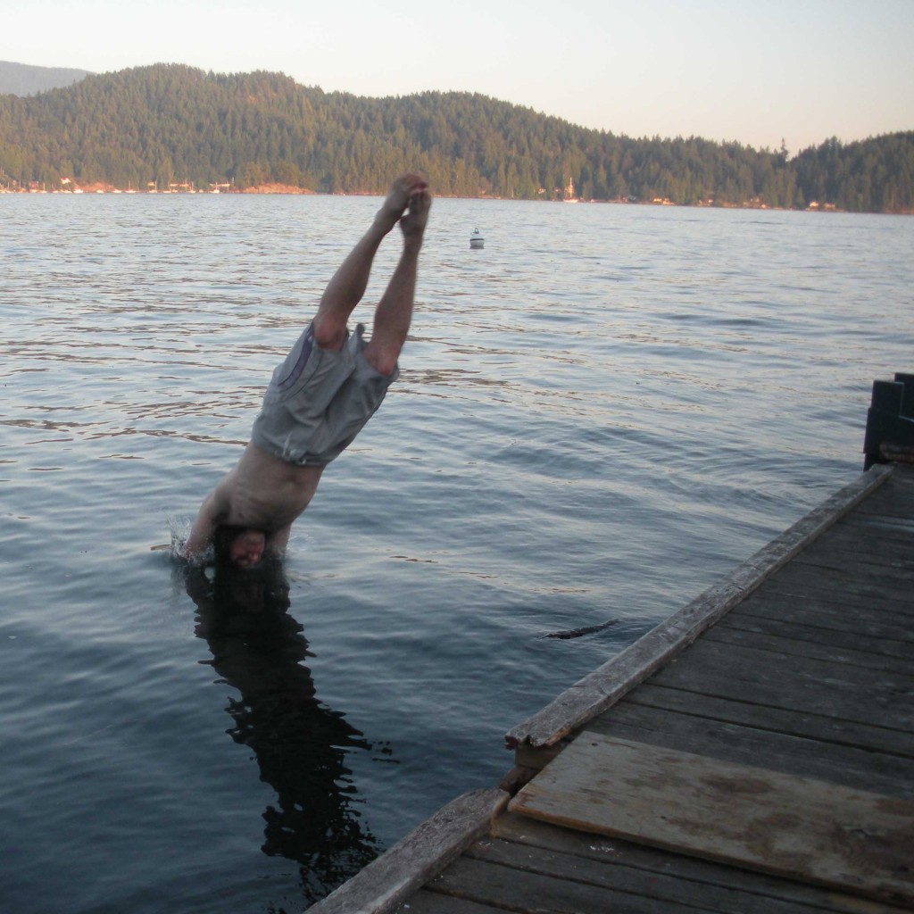 Our fearless Chairman of the Board (Bjorn Enga) dives into the frigid water off the old floating dock in May 2010.
